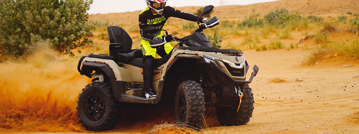 ATV high ground clearance and wide off-road tires for rough terrain