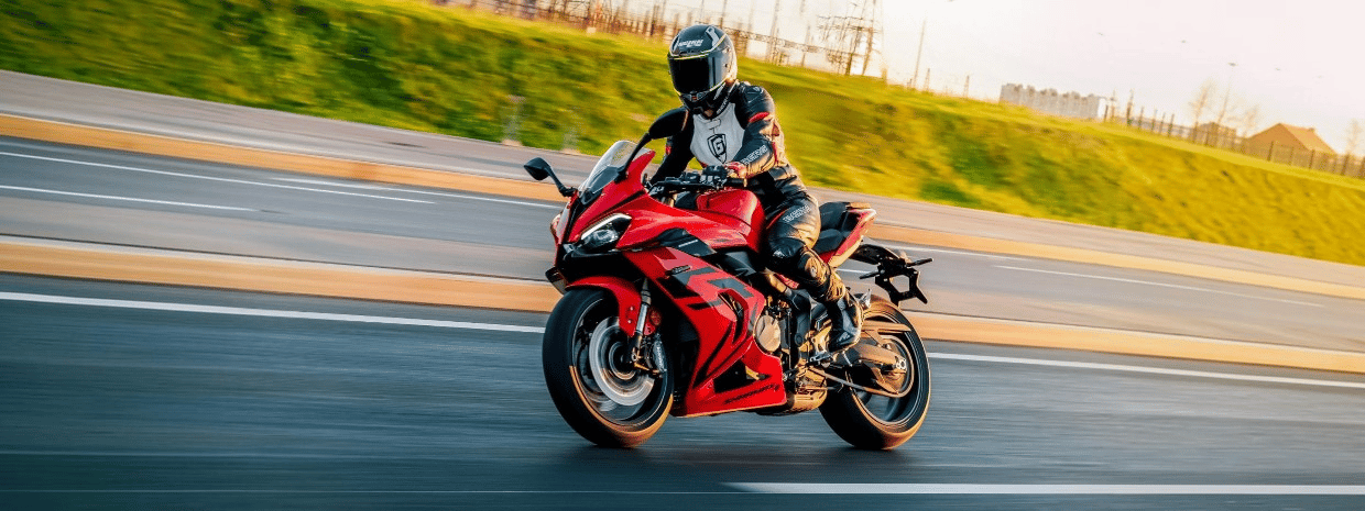 Motorcycle riding experience on the open road Sport motorcycle rider enjoying a ride on an open road