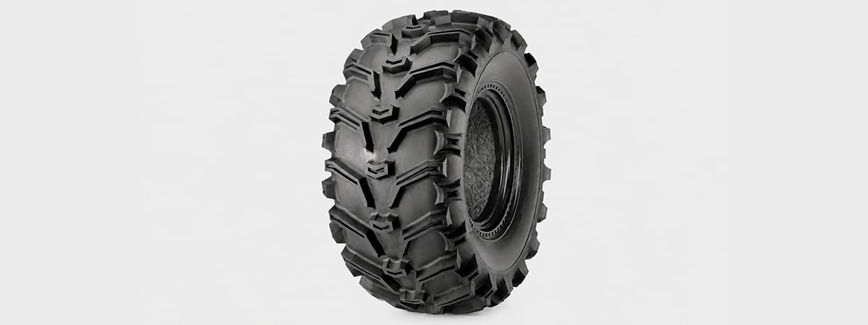 Close-up of an aggressive mud tire on an ATV wheel