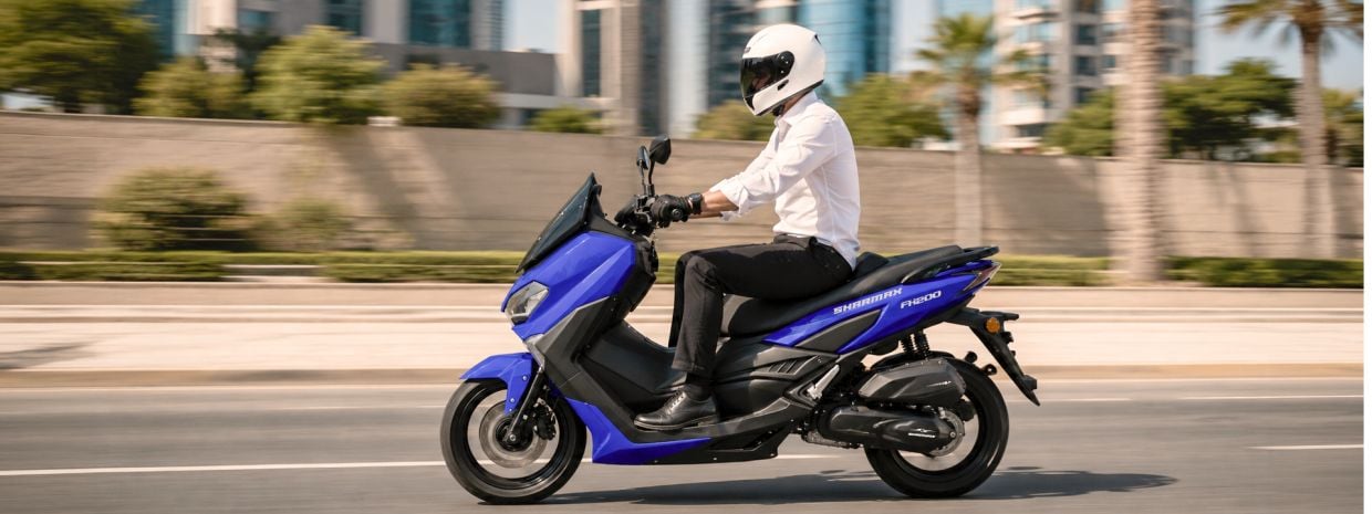 Motorcycle for daily commuting in urban traffic Sharmax scooter riding through a modern city street during daily commuting